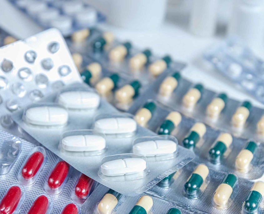 Various pill sizes and shapes within blister packages
