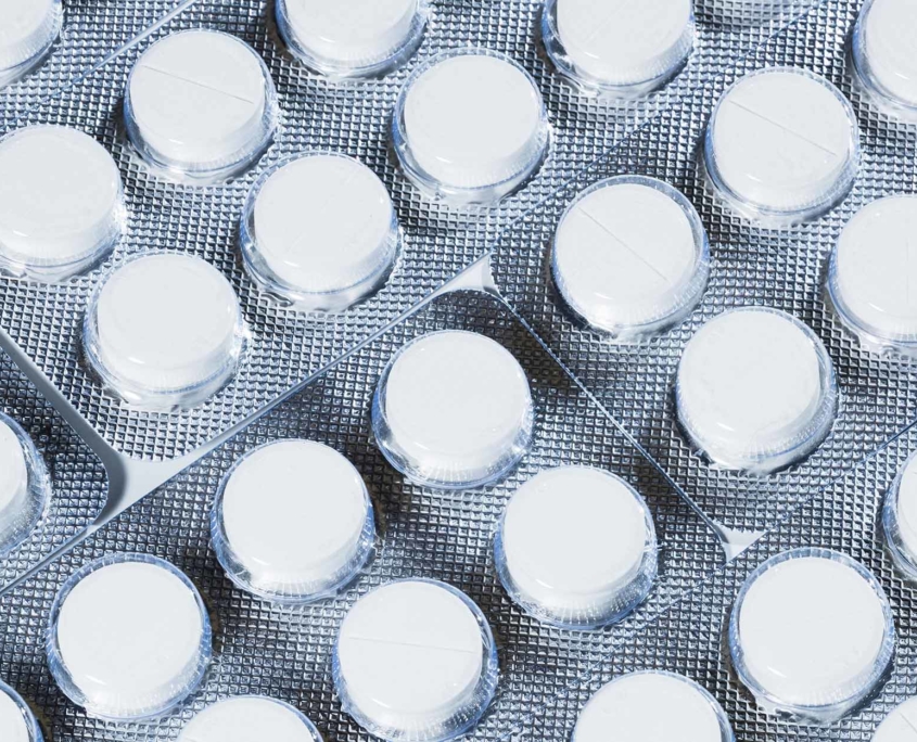 Close up view of white pills in a blister package