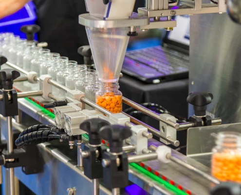 Machine filling pill bottles_november1