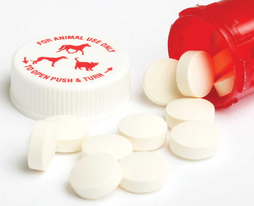 red veterinary drug packaging with a cap