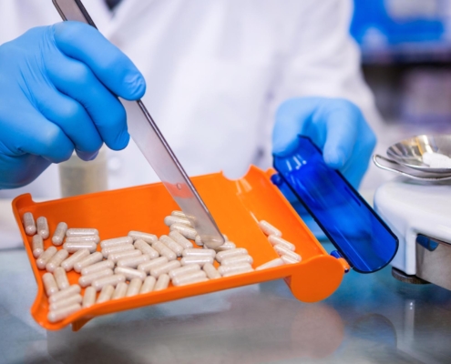 Image of a professional counting medication on a tray