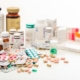 Variety of different medications packaged on a table.