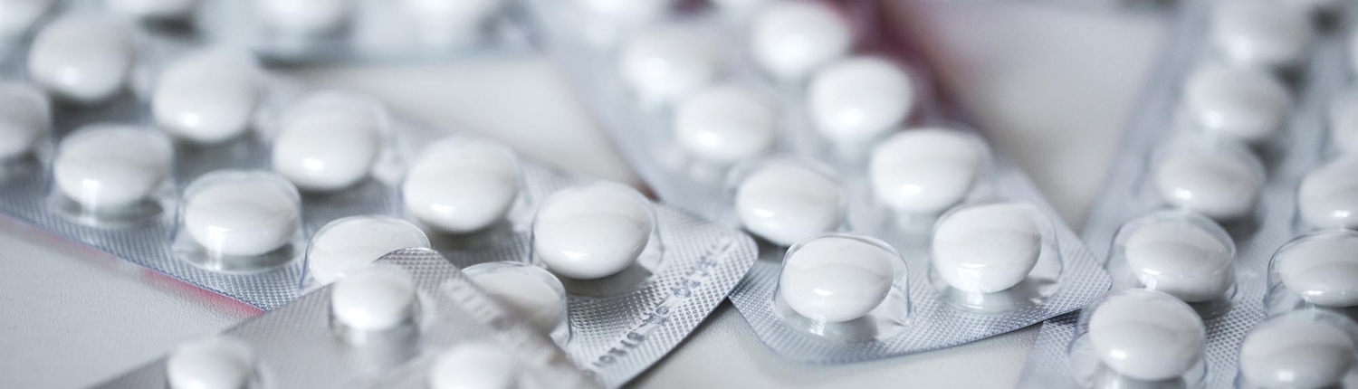 Close-up of multiple medicinal blister packages with white tablets inside Close-up of multiple medicinal blister packages with white tablets inside
