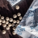 packets of desiccant scattered on a dark surface